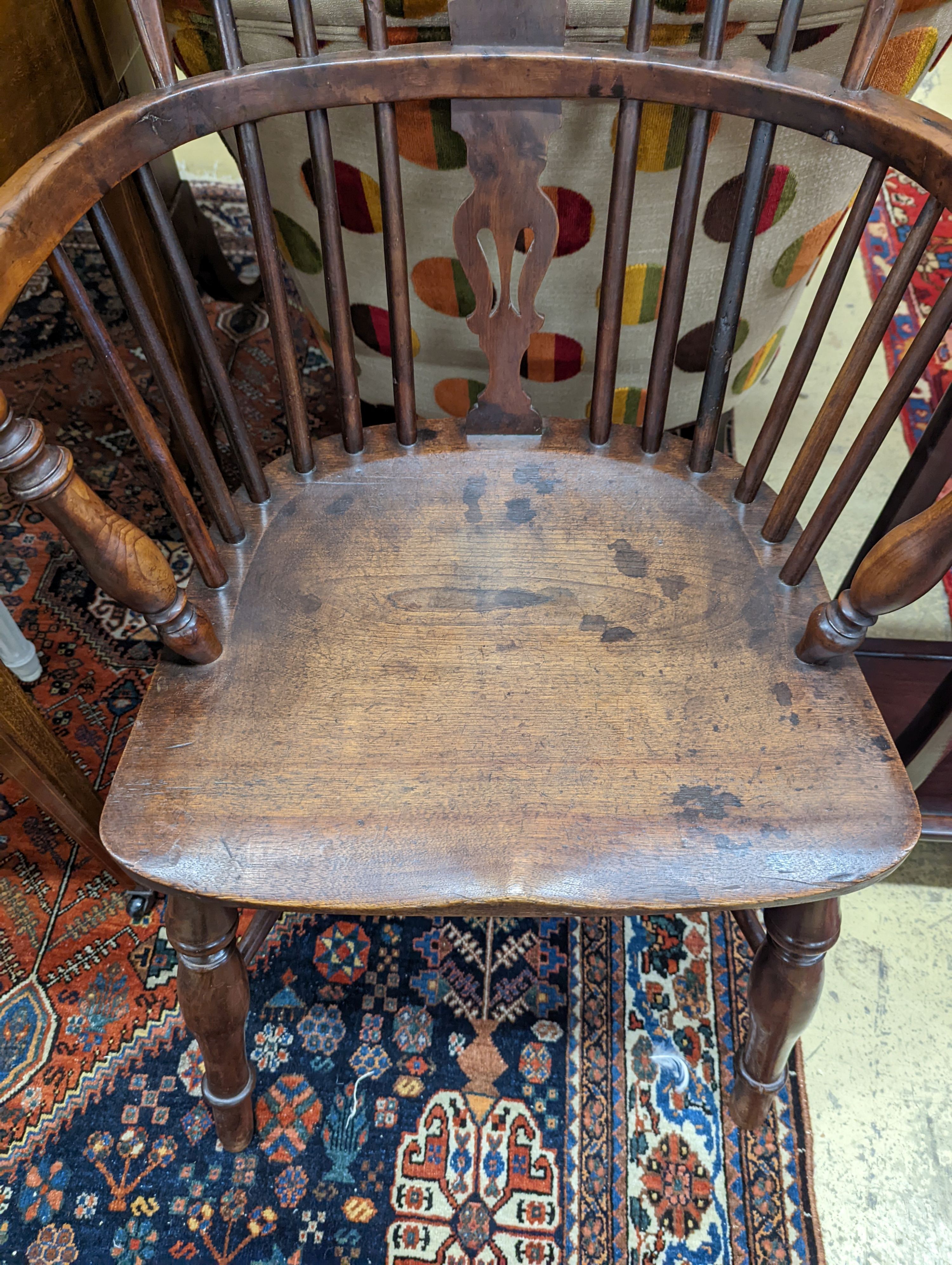 A mid 19th century Windsor yew and elm Windsor elbow chair, width 58cm, depth 42cm, height 91cm